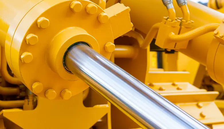 Yellow hydraulic cylinder with polished chrome rod and bolted flange
