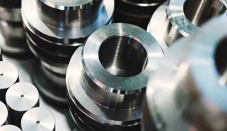 Machined steel flanged cylindrical components with bored centers