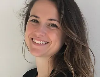 Dina Roberts, smiling woman with long brown hair