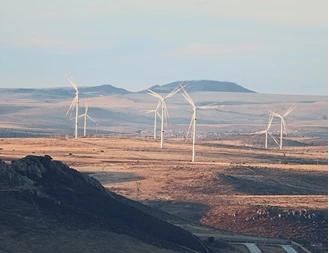 Wind turbines on a dry hilltop landscape