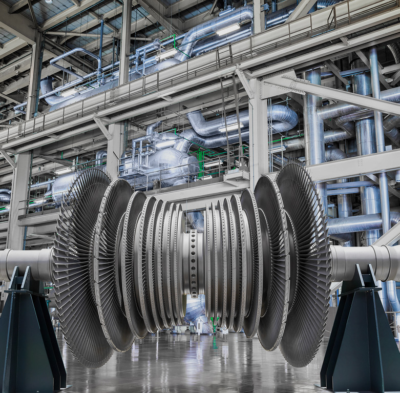 Steam turbine rotor with bladed discs on stands in a power plant